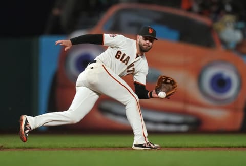 SAN FRANCISCO, CA – SEPTEMBER 25: Evan Lonngoria #10 of the San Francisco Giants reacts to field a ground ball off the bat of Franmil Reyes #32 of the San Diego Padres in the top of the six inning at AT&T Park on September 25, 2018 in San Francisco, California. (Photo by Thearon W. Henderson/Getty Images)