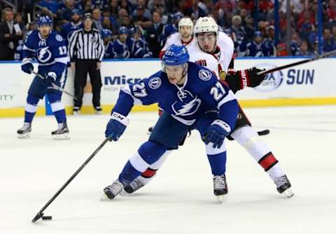 Dec 10, 2015; Tampa, FL, USA; Tampa Bay Lightning left wing Jonathan Drouin (27) skates with the puck as Ottawa Senators center Mika Zibanejad (93) defends during the first period at Amalie Arena. Mandatory Credit: Kim Klement-USA TODAY Sports