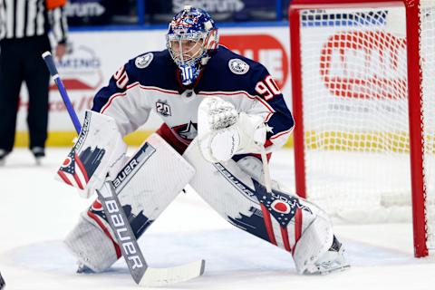 Apr 1, 2021; Tampa, Florida, USA; Columbus Blue Jackets goaltender Elvis Merzlikins (90) defends during the first period against the Tampa Bay Lightning at Amalie Arena. Mandatory Credit: Kim Klement-USA TODAY Sports