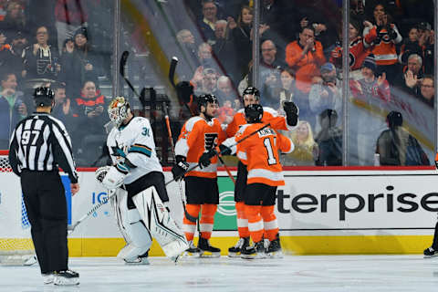 PHILADELPHIA, PA – FEBRUARY 25: Scott Laughton #21, Kevin Hayes #13 and Travis Konecny #11 of the Philadelphia Flyers celebrate goal as Aaron Dell #30 of the San Jose Sharks skates away in the second period at Wells Fargo Center on February 25, 2020 in Philadelphia, Pennsylvania. (Photo by Drew Hallowell/Getty Images)