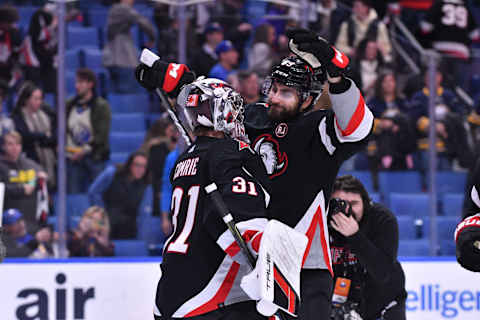 Oct 21, 2023; Buffalo, New York, USA; Buffalo Sabres right wing Alex Tuch (89) congratulates goaltender Eric Comrie (31) after winning a game against the New York Islanders at KeyBank Center. Mandatory Credit: Mark Konezny-USA TODAY Sports