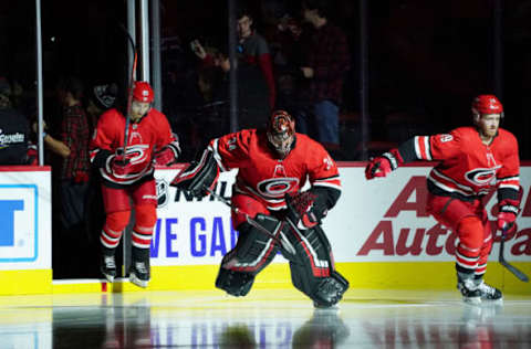 RALEIGH, NC – OCTOBER 29: Petr Mrazek #34 of the Carolina Hurricanes enters the ice during warmups with teammates Dougie Hamilton #19 and Sebastian Aho #20 prior to an NHL game against the Calgary Flames on October 29, 2019 at PNC Arena in Raleigh, North Carolina. (Photo by Gregg Forwerck/NHLI via Getty Images)