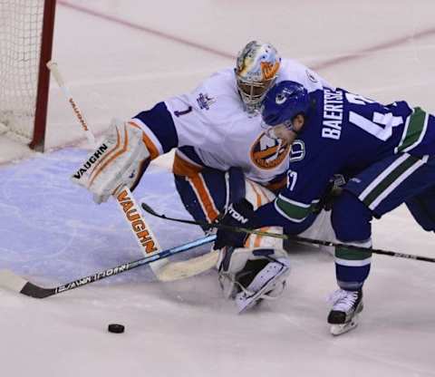 Mar 1, 2016; Vancouver, British Columbia, CAN; Vancouver Canucks forward Sven Baertschi (47) moves the puck against New York Islanders goaltender 