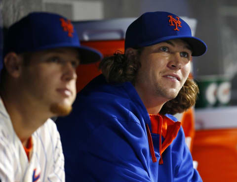 NEW YORK, NY – AUGUST 2: Zack Wheeeler #45 and Jacob deGrrom #48 of the New York Mets in the dugout during a game against the San Francisco Giants on August 2, 2014 at Citi Field in the Flushing neighborhood of the Queens borough of New York City. (Photo by Rich Schultz/Getty Images)