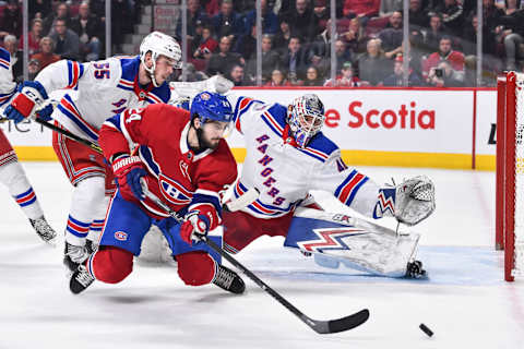 Goaltender Alexandar Georgiev #40 of the New York Rangers stretches out the glove and pad to defend the net against Phillip Danault #24 of the Montreal Canadiens (Photo by Minas Panagiotakis/Getty Images)