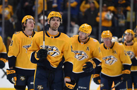 Apr 1, 2023; Nashville, Tennessee, USA; Nashville Predators center Tommy Novak (82) celebrates with teammates after a win against the St. Louis Blues at Bridgestone Arena. Mandatory Credit: Christopher Hanewinckel-USA TODAY Sports