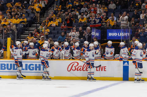 Oct 17, 2023; Nashville, Tennessee, USA; The Edmonton Oilers celebrate a goal during the first period of their game against the Nashville Predators at Bridgestone Arena. Mandatory Credit: Alan Poizner-USA TODAY Sports