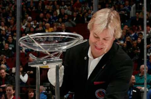 VANCOUVER, CANADA – APRIL 7: Philip Pritchard, Vice President of Hockey Operations at the Hockey Hall of Fame, places the Presidents’ trophy on a table during the game between the Minnesota Wild and the Vancouver Canucks at Rogers Arena on April 7, 2011 in Vancouver, British Columbia, Canada. The Canucks won 5-0. (Photo by Jeff Vinnick/NHLI via Getty Images)