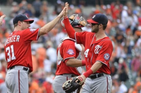 Jul 12, 2015; Baltimore, MD, USA; Washington Nationals starting pitcher Max Scherzer (31) high fives right fielder Bryce Harper (34) after defeating Baltimore Orioles 3-2 at Oriole Park at Camden Yards. Mandatory Credit: Tommy Gilligan-USA TODAY Sports