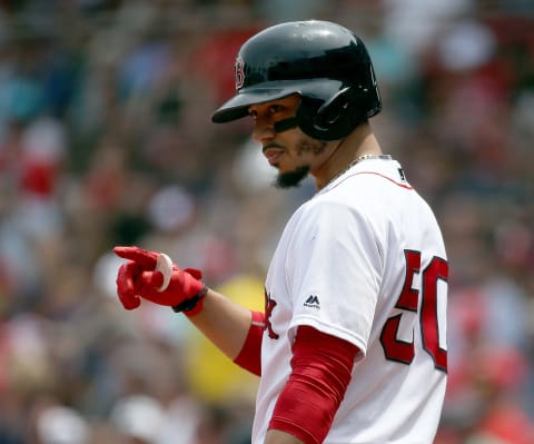 BOSTON, MA – JULY 29: Mookie Betts #50 of the Boston Red Sox gestures before batting against the Minnesota Twins in the first inning at Fenway Park on July 29, 2018 in Boston, Massachusetts. (Photo by Jim Rogash/Getty Images)