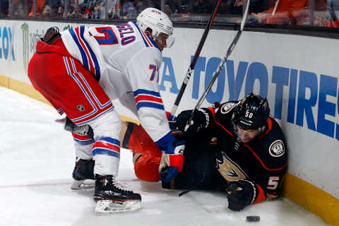 ANAHEIM, CA – JANUARY 23: Anthony DeAngelo #77 of the New York Rangers battles for the puck against Antoine Vermette #50 of the Anaheim Ducks during the game on January 23, 2018 at Honda Center in Anaheim, California. (Photo by Debora Robinson/NHLI via Getty Images)