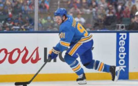 Jan 2, 2017; St. Louis, MO, USA; St. Louis Blues right wing Vladimir Tarasenko (91) skates with the puck against the Chicago Blackhawks during the second period in the 2016 Winter Classic ice hockey game at Busch Stadium. Mandatory Credit: Jasen Vinlove-USA TODAY Sports