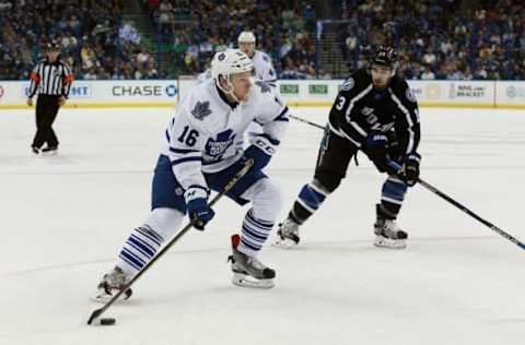 Mar 28, 2016; Tampa, FL, USA; Toronto Maple Leafs right wing Connor Brown (16) skates with the puck as Tampa Bay Lightning center Cedric Paquette (13) defends during the first period at Amalie Arena. Mandatory Credit: Kim Klement-USA TODAY Sports