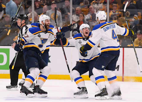 BOSTON, MASSACHUSETTS – MAY 29: Carl Gunnarsson #4 of the St. Louis Blues celebrates with teammates after scoring the game-winning goal during the first overtime period to defeat the Boston Bruins 3-2 in Game Two of the 2019 NHL Stanley Cup Final at TD Garden on May 29, 2019 in Boston, Massachusetts. (Photo by Scott Rovak/NHLI via Getty Images)