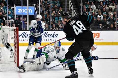 SAN JOSE, CA – DECEMBER 14: Tomas Hertl #48 of the San Jose Sharks scores a goal against Jacob Markstrom #23 of the Vancouver Canucks at SAP Center on December 14, 2019 in San Jose, California. (Photo by Brandon Magnus/NHLI via Getty Images)