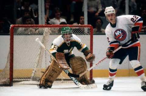 UNIONDALE, NY – CIRCA 1981: Goalie Don Beaupre #33 of the Minnesota North Stars defends his goal against Mike Bossy #22 of the New York Islanders during the 1981 NHL Stanley Cup Finals at the Nassau Veterans Memorial Coliseum in Uniondale, New York. Beaupre’s playing career went from 1980-97. (Photo by Focus on Sport/Getty Images)