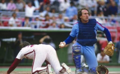 PHILADELPHIA, PA – CIRCA 1982: Gary Carter #8 of the Montreal Expos looks on after making a play on the runner at home plate against the Philadelphia Phillies during an Major League Baseball game circa 1982 at Veterans Stadium in Philadelphia, Pennsylvania. Carter played for the Expos from 1974-84 and 1992. (Photo by Focus on Sport/Getty Images)