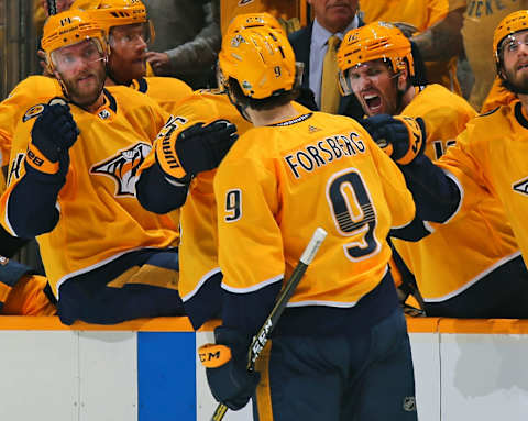 NASHVILLE, TN – APRIL 12: Mattias Ekholm #14 and Mike Fisher #12 celebrate with teammate Filip Forsberg #9 of the Nashville Predators Forsberg’s second goal of the game against the Colorado Avalanche during the third period of a 5-2 Predators victory in Game One of the Western Conference First Round during the 2018 NHL Stanley Cup Playoffs at Bridgestone Arena on April 12, 2018 in Nashville, Tennessee. (Photo by Frederick Breedon/Getty Images)