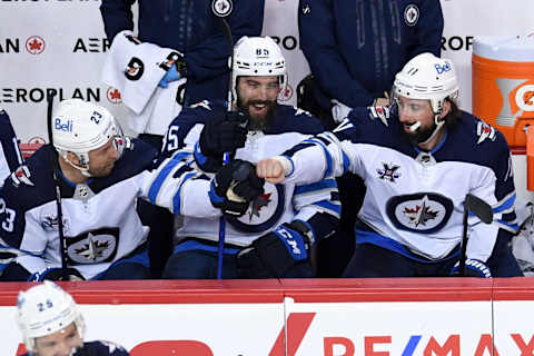 Winnipeg Jets, Nate Thompson (11), Trevor Lewis (23), Mathieu Perreault (85). Mandatory Credit: Candice Ward-USA TODAY Sports