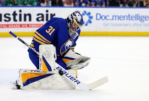 Mar 9, 2023; Buffalo, New York, USA; Buffalo Sabres goaltender Eric Comrie (31) makes a save during the first period against the Dallas Stars at KeyBank Center. Mandatory Credit: Timothy T. Ludwig-USA TODAY Sports