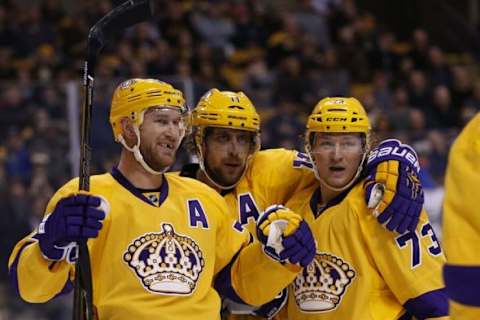 Feb 9, 2016; Boston, MA, USA; Los Angeles Kings center Jeff Carter (77) celebrates with center Anze Kopitar (11) and right wing Tyler Toffoli (73) after scoring a goal against the Boston Bruins during the first period at TD Garden. Mandatory Credit: Greg M. Cooper-USA TODAY Sports