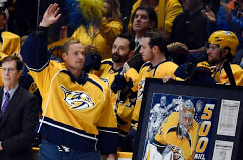 Mar 25, 2017; Nashville, TN, USA; Nashville Predators goalie Pekka Rinne (35) waves to the crowd as he is honored before the game for his 500th career game at Bridgestone Arena. Mandatory Credit: Christopher Hanewinckel-USA TODAY Sports