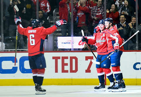 WASHINGTON, DC – MARCH 10; Washington Capitals center Nicklas Backstrom (19) is congratulated by Washington Capitals defenseman John Carlson (74) and defenseman Michal Kempny (6) after his first period goal against the Winnipeg Jets on March 10, 2019, at the Capital One Arena in Washington, D.C. (Photo by Mark Goldman/Icon Sportswire via Getty Images)