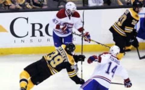 Oct 22, 2016; Boston, MA, USA; Boston Bruins left wing Matt Beleskey (39) collides with Montreal Canadiens center Tomas Plekanec (14) during the third period at TD Garden. Mandatory Credit: Bob DeChiara-USA TODAY Sports