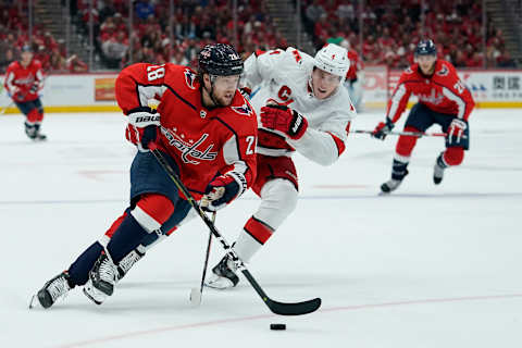 WASHINGTON, DC – OCTOBER 05: Brendan Leipsic #28 of the Washington Capitals skates with the puck against Haydn Fleury #4 of the Carolina Hurricanes in the third period at Capital One Arena on October 5, 2019 in Washington, DC. (Photo by Patrick McDermott/NHLI via Getty Images)