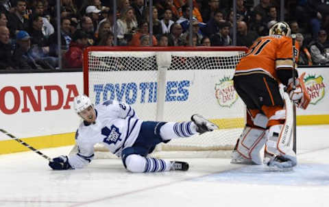 Jan 6, 2016; Anaheim, CA, USA; Toronto Maple Leafs left wing James van Riemsdyk (21) collides with the goal as Anaheim Ducks goalie Frederik Andersen (31) watches during an NHL game at Honda Center. The Maple Leafs defeated the Ducks 4-0. Mandatory Credit: Kirby Lee-USA TODAY Sports