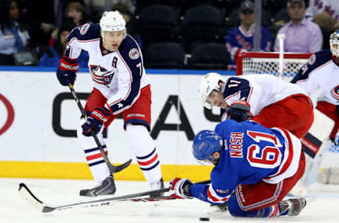 NEW YORK, NY – DECEMBER 12: Rick Nash #61 of the New York Rangers and Matt Calvert #11 of the Columbus Blue Jackets collide as Jack Johnson #3 of the Blue Jackets looks on at Madison Square Garden on December 12, 2013, in New York City. (Photo by Elsa/Getty Images)