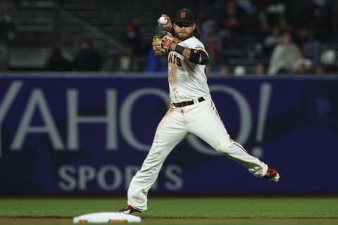 SAN FRANCISCO, CA – SEPTEMBER 24: Brandon Crawwford #35 of the San Francisco Giants throws to first base after fielding a ground ball hit off that bat of Manuel Margot (not pictured) of the San Diego Padres during the seventh inning at AT&T Park on September 24, 2018 in San Francisco, California. The San Diego Padres defeated the San Francisco Giants 5-0. (Photo by Jason O. Watson/Getty Images)