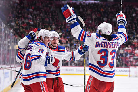 MONTREAL, QC – FEBRUARY 27: Ryan Strome #16, Ryan Lindgren #55 and Phillip Di Giuseppe #33 of the New York Rangers celebrate a goal by Adam Fox #23 (not pictured) against the Montreal Canadiens during the third period at the Bell Centre on February 27, 2020 in Montreal, Canada. The New York Rangers defeated the Montreal Canadiens 5-2. (Photo by Minas Panagiotakis/Getty Images)