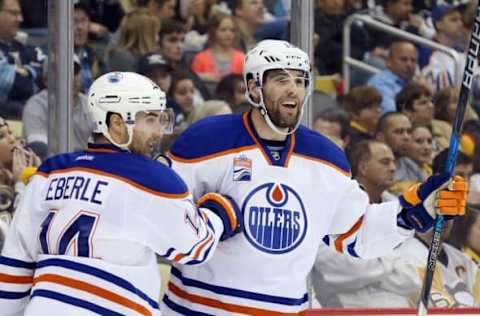 Nov 8, 2016; Pittsburgh, PA, USA; Edmonton Oilers right wing Jordan Eberle (14) and left wing Patrick Maroon (19) celebrate a goal by Maroon against the Pittsburgh Penguins during the first period at the PPG Paints Arena. Mandatory Credit: Charles LeClaire-USA TODAY Sports