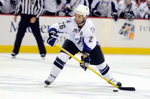 WASHINGTON, DC – MAY 01: Martin St. Louis #26 of the Tampa Bay Lightning handles the puck against the Washington Capitals during Game Two of the Eastern Conference Semifinal during the 2011 NHL Stanley Cup Playoffs at the Verizon Center on May 1, 2011 in Washington, DC. Tampa won the game 3-2. (Photo by G Fiume/Getty Images)