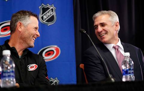 Thomas Dundon, left, laughs with Carolina Hurricanes general manager Ron Francis as Dundon is introduced as the team’s new majority owner at a news conference at PNC Arena in Raleigh, N.C., on Friday, Jan. 12, 2018. at PNC Arena in Raleigh, N.C., on Friday, Jan. 12, 2018. (Chris Seward/Raleigh News