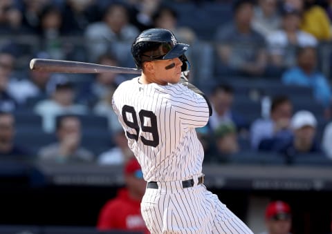 NEW YORK, NEW YORK – APRIL 20: Aaron Judge #99 of the New York Yankees hits a single in the first inning against the Los Angeles Angels at Yankee Stadium on April 20, 2023 in the Bronx borough of New York City. (Photo by Elsa/Getty Images)