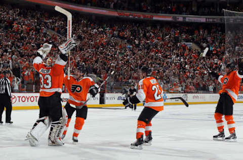 PHILADELPHIA – APRIL 11: Brian Boucher #33 of the Philadelphia Flyers celebrates his game winning shootout save against the New York Rangers with teammates Daniel Briere #48, Matt Carle #25, and Scott Hartnell #19 on April 11, 2010 at Wachovia Center in Philadelphia, Pennsylvania. The Flyers defeated the Rangers 2-1 after a shootout. The victory clinched a playoff berth for Philadelphia. (Photo by Jim McIsaac/Getty Images)