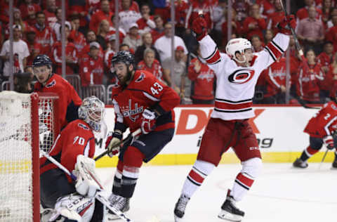 WASHINGTON, DC – APRIL 24: Brock McGinn #23 of the Carolina Hurricanes scores the game winning goal against Braden Holtby #70 of the Washington Capitals at 11:05 of the second overime period in Game Seven of the Eastern Conference First Round during the 2019 NHL Stanley Cup Playoffs at the Capital One Arena on April 24, 2019 in Washington, DC. The Hurricanes defeated the Capitals 4-3 in the second overtime period to move on to Round Two of the Stanley Cup playoffs. (Photo by Patrick Smith/Getty Images)