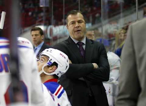 Jan 22, 2016; Raleigh, NC, USA; New York Rangers head coach Alain Vigneault looks on from behind the bench during the game against the Carolina Hurricanes at PNC Arena. The New York Rangers defeated the Carolina Hurricanes 4-1. Mandatory Credit: James Guillory-USA TODAY Sports