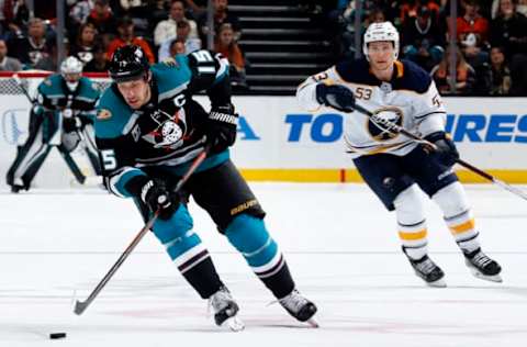 ANAHEIM, CA – OCTOBER 21: Ryan Getzlaf #15 of the Anaheim Ducks skates with the puck with pressure from Jeff Skinner #53 of the Buffalo Sabres during the game on October 21, 2018, at Honda Center in Anaheim, California. (Photo by Debora Robinson/NHLI via Getty Images)