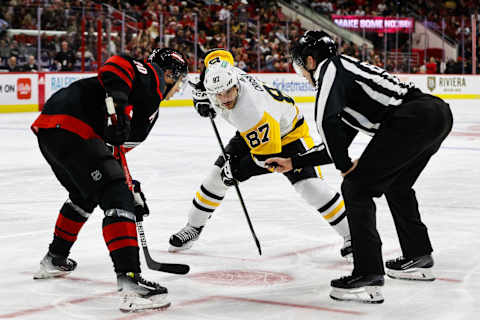 RALEIGH, NC – NOVEMBER 18: Sidney Crosby #87 of the Pittsburgh Penguins faces off with Sebastian Aho #20 of the Carolina Hurricanes during the third period of the game at PNC Arena on November 18, 2023 in Raleigh, North Carolina. (Photo by Jaylynn Nash/Getty Images)