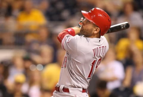 Sep 10, 2016; Pittsburgh, PA, USA; Cincinnati Reds first baseman Joey Votto (19) hits a solo home run against the Pittsburgh Pirates during the ninth inning at PNC Park. The Reds won 8-7. Mandatory Credit: Charles LeClaire-USA TODAY Sports