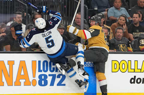 Vegas Golden Knights, Jonathan Marchessault (81); Winnipeg Jets, Brenden Dillon (5). Mandatory Credit: Stephen R. Sylvanie-USA TODAY Sports