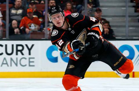 ANAHEIM, CA: Josh Manson #42 of the Anaheim Ducks dumps the puck during the game against the San Jose Sharks on January 21, 2018. (Photo by Debora Robinson/NHLI via Getty Images)