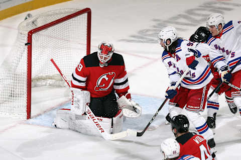 NEWARK, NEW JERSEY – APRIL 13: Mika Zibanejad #93 of the New York Rangers watches a second period shot against Mackenzie Blackwood #29 of the New Jersey Devils miss the net at the Prudential Center on April 13, 2021 in Newark, New Jersey. (Photo by Bruce Bennett/Getty Images)