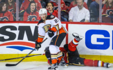 Anaheim Ducks right wing Chris Wagner (21) checks into the boards Calgary Flames defenseman Mark Giordano (5) (Sergei Belski-USA TODAY Sports)