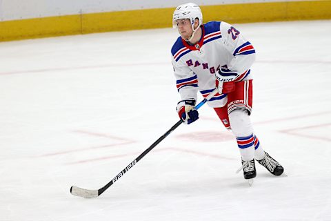 WASHINGTON, DC – MARCH 20: Adam Fox #23 of the New York Rangers skates with the puck against the Washington Capitals at Capital One Arena on March 20, 2021 in Washington, DC. (Photo by Rob Carr/Getty Images)