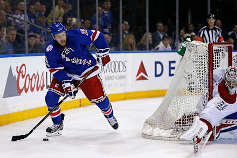 Apr 16, 2017; New York, NY, USA; New York Rangers center Derek Stepan (21) looks to pass around Montreal Canadiens goalie Carey Price (31) during the second period in game three of the first round of the 2017 Stanley Cup Playoffs at Madison Square Garden. Mandatory Credit: Adam Hunger-USA TODAY Sports