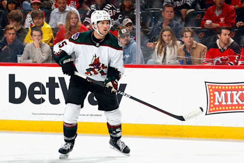 NEWARK, NEW JERSEY – OCTOBER 13: Alexander Kerfoot #15 of the Arizona Coyotes skates against the New Jersey Devils at Prudential Center on October 13, 2023 in Newark, New Jersey. (Photo by Bruce Bennett/Getty Images)